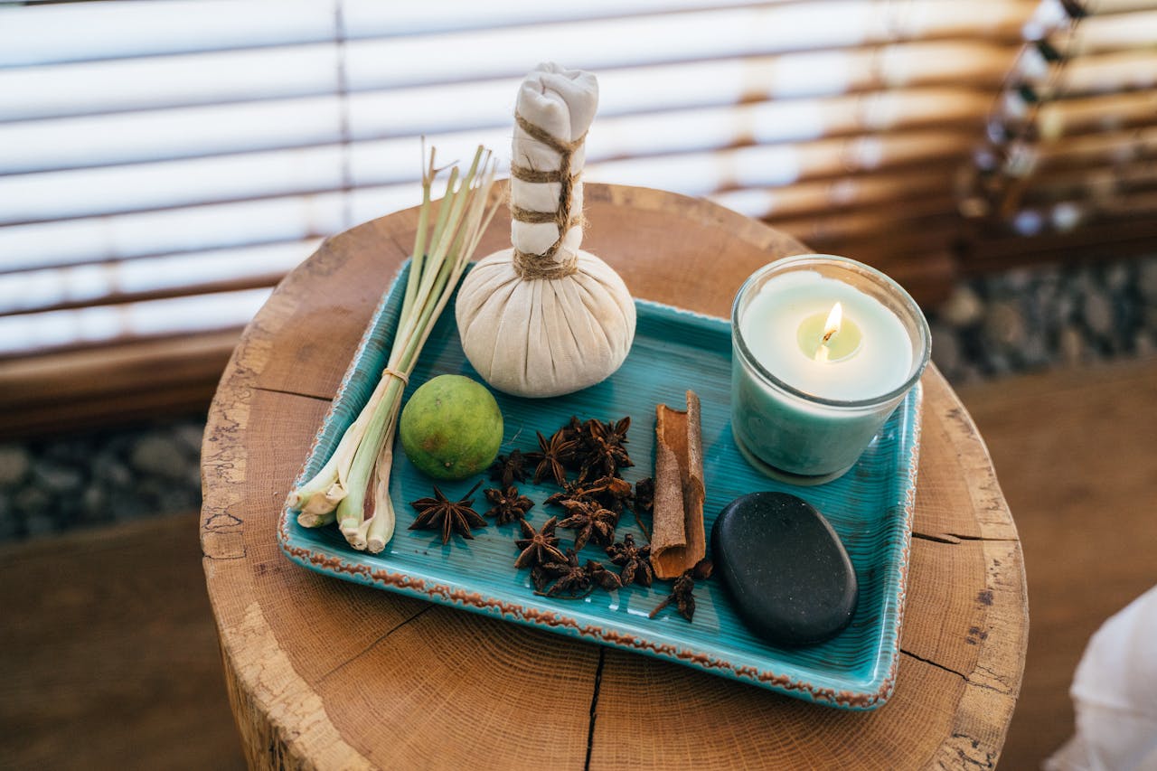Beautiful spa setting featuring aromatherapy items on a wooden table for relaxation.